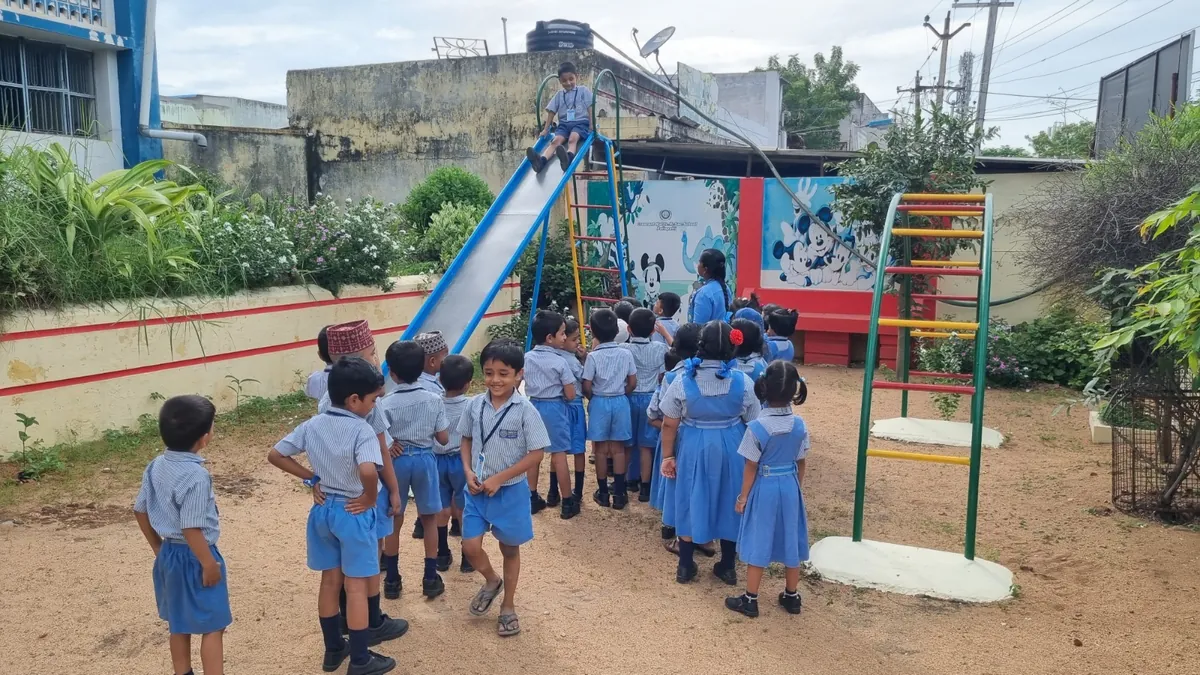 Young students playing at the kindergarten play area