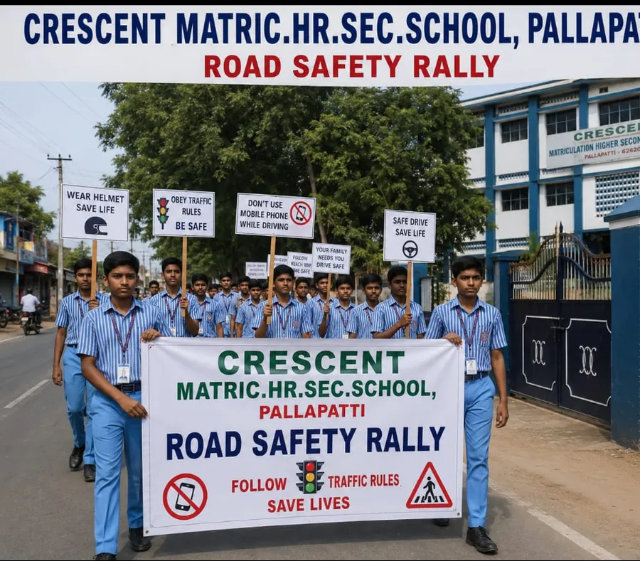 Students marching outside the school gates with placards and a banner during the Crescent road safety rally