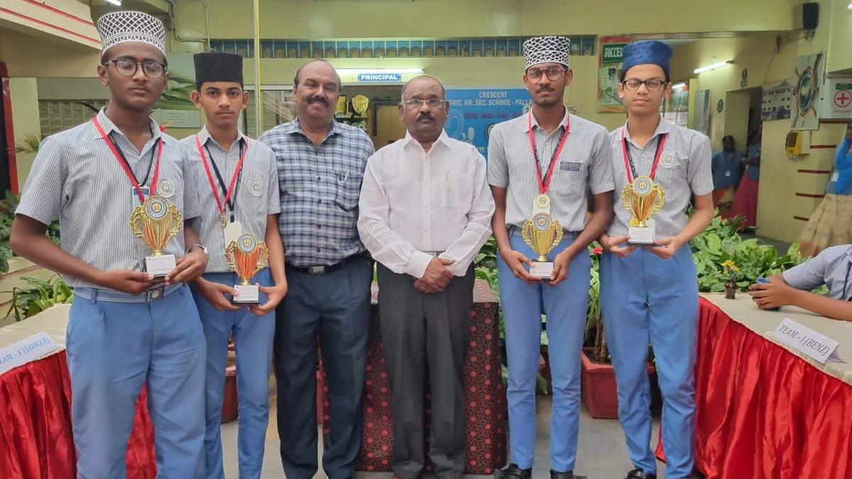 Crescent students receiving trophies at a prize presentation