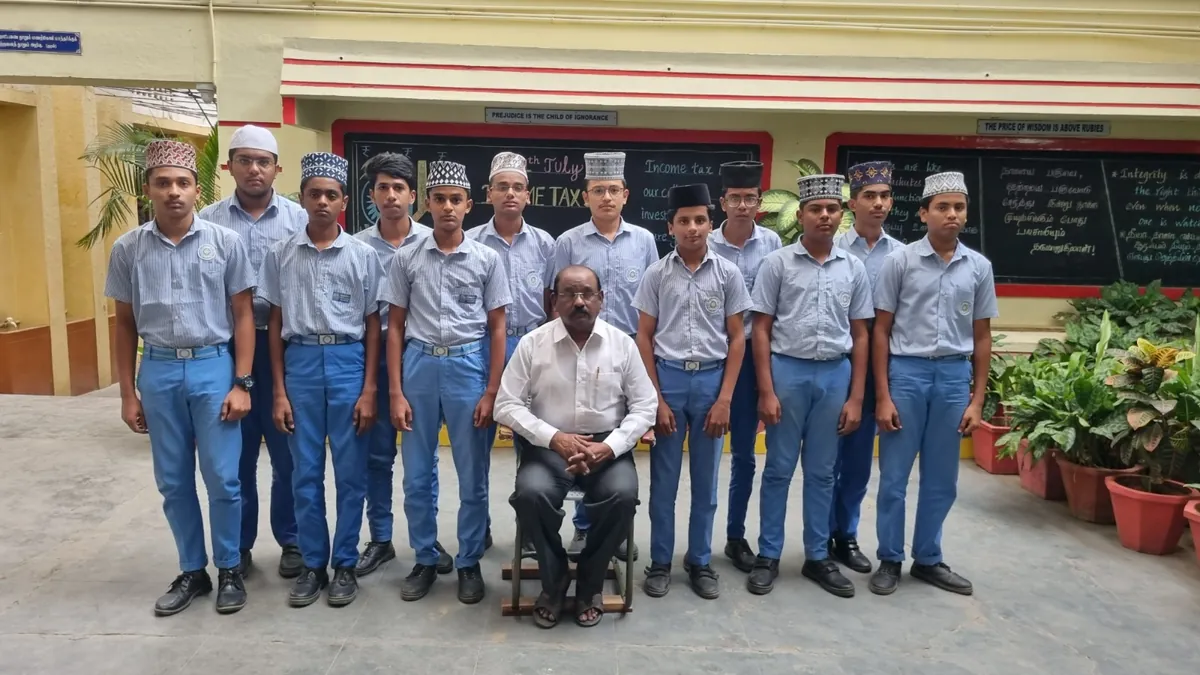 Crescent students with a staff member on the school corridor